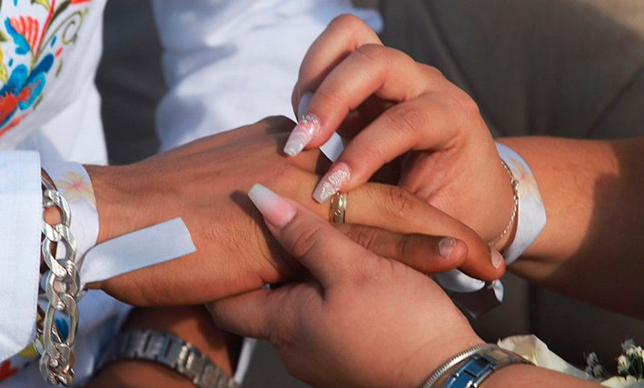 A beachfront wedding ceremony setup at a Cancún hotel, where Catholic officials warn fake priests have officiated religious services