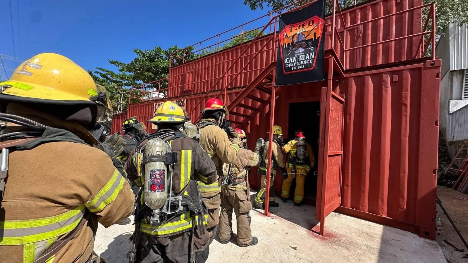 Firefighters in protective gear take part in a practical rescue drill at the Second National Firefighters Congress in Playa del Carmen, Quintana Roo