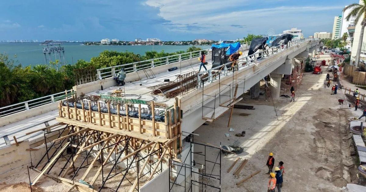 Construction crews work on the elevated Kukulcán interchange that will connect the Nichupté bridge with Kukulcán Boulevard in Cancún