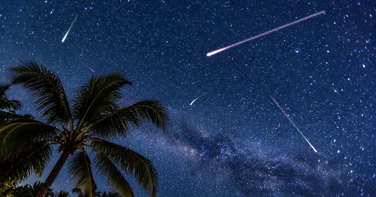 Bright meteors streaking across a dark starry night sky during the Orionid meteor shower
