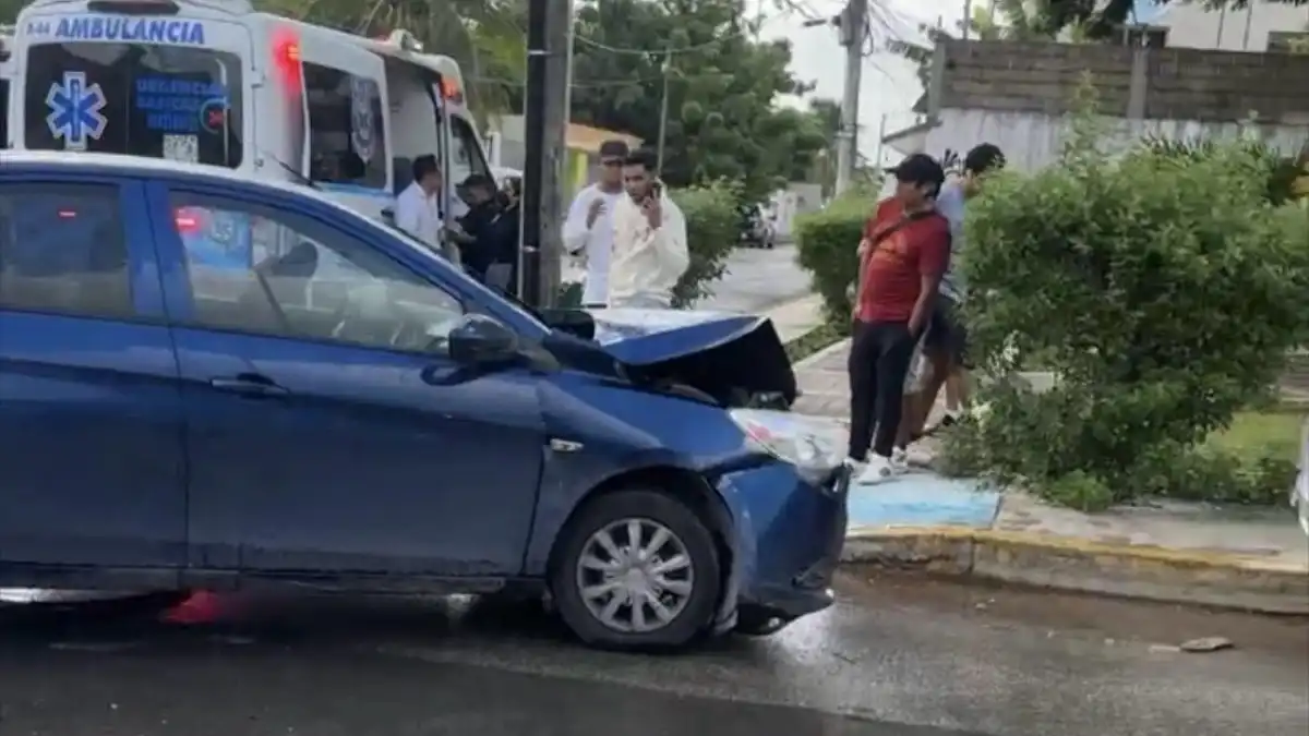Two damaged compact cars at the scene of a collision in the Zazil-Há neighborhood of Playa del Carmen