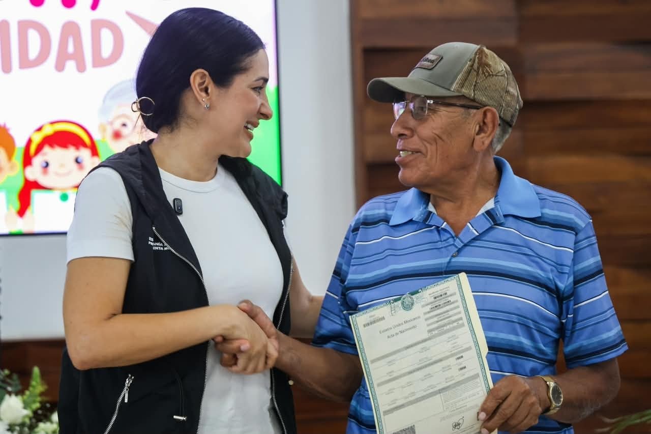 Playa del Carmen Mayor Estefanía Mercado speaks at a ceremony where 88 birth certificates were handed to residents who lacked legal identity