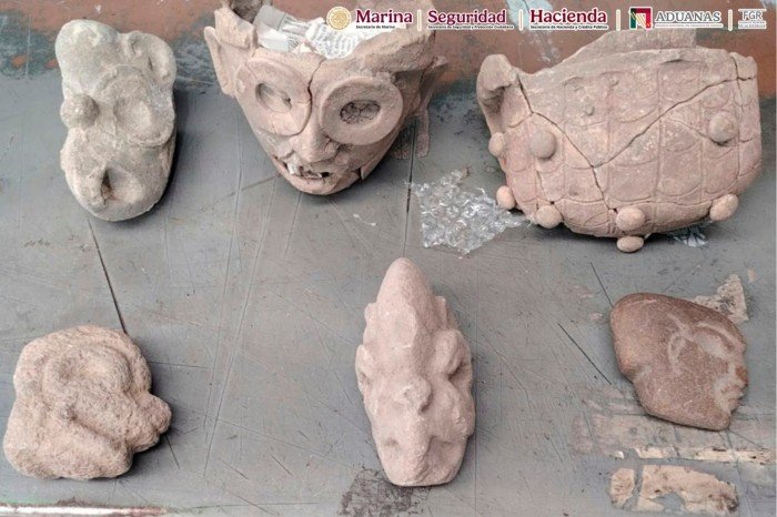 Archaeological artifacts from Veracruz laid out on a surface after being intercepted at Mexico City International Airport while being shipped to Great Britain