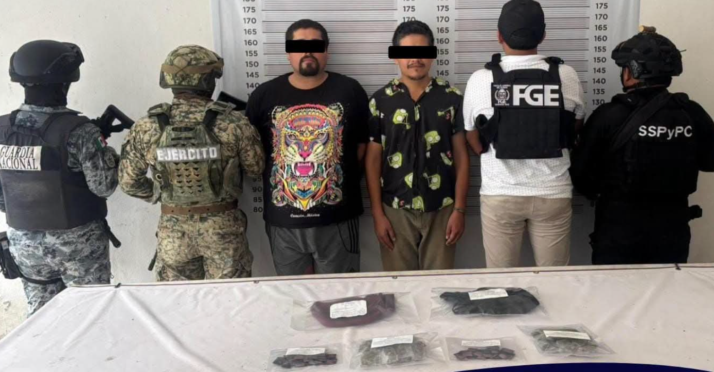 Police officers stand guard during a security operation in Tulum, Quintana Roo