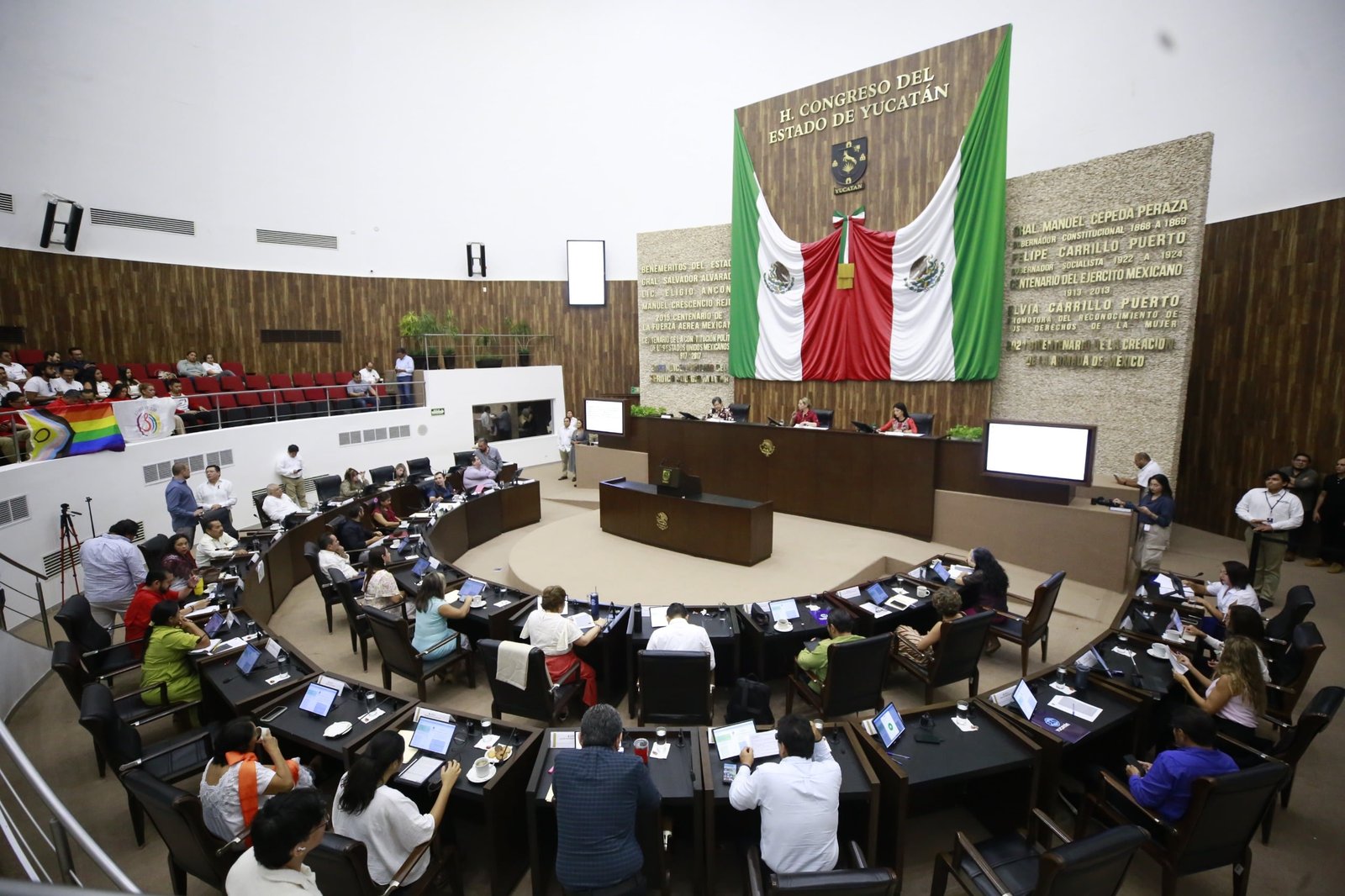 Lawmakers seated in the Yucatán Congress chamber in Mérida during a session on HIV decriminalization